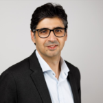 Professional man wearing glasses and blazer portrait