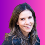 Smiling woman with brown hair on pink background