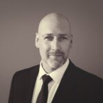 Bald man in suit and tie portrait
